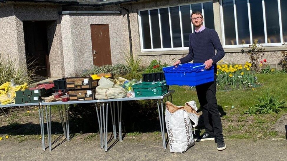 Neil Campbell organising food larder