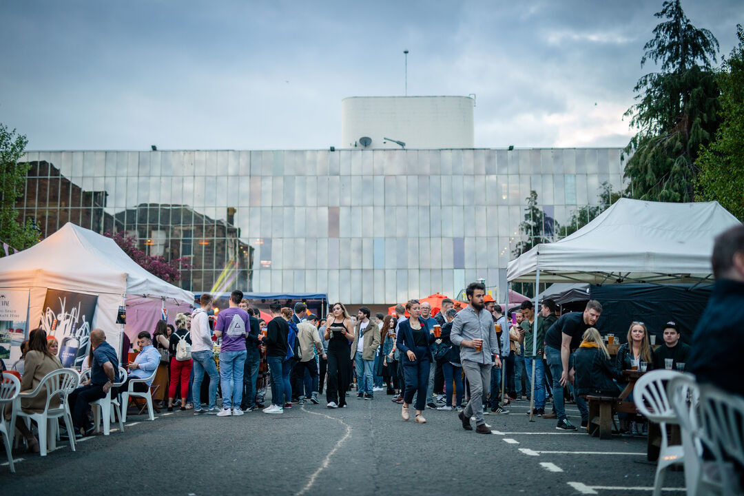 students looking at various stalls outside the student union