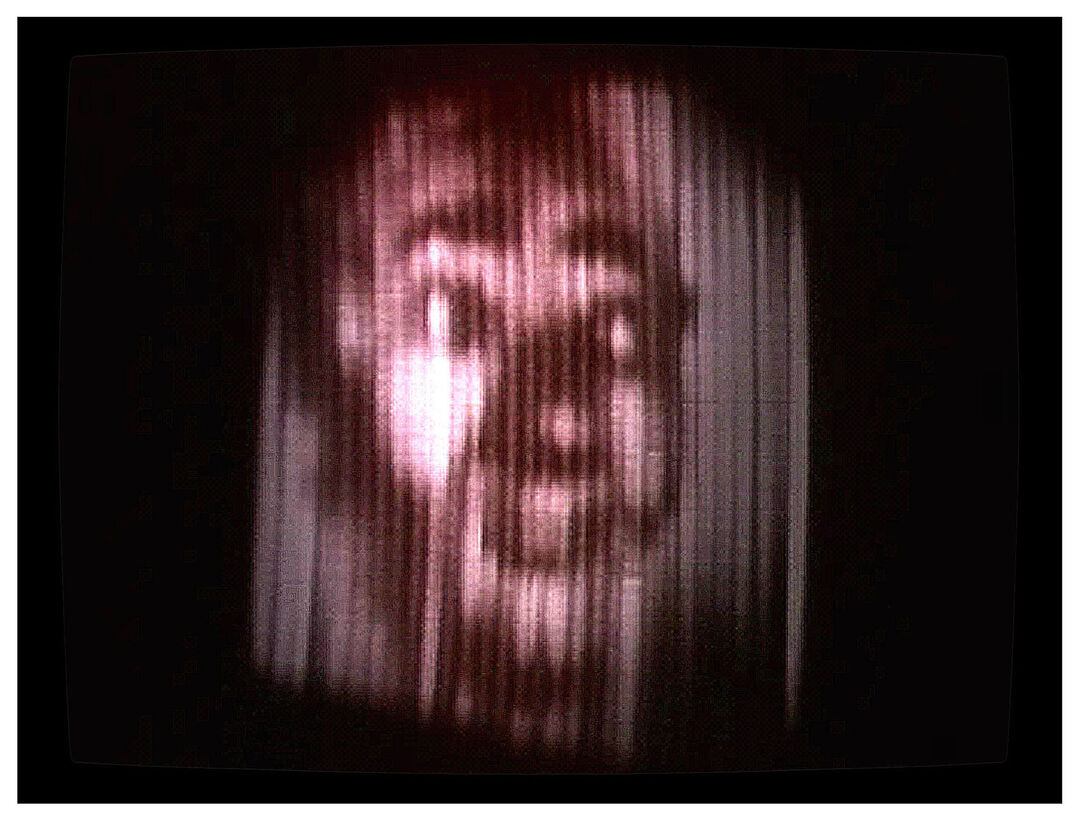 head on a screen with lines down it