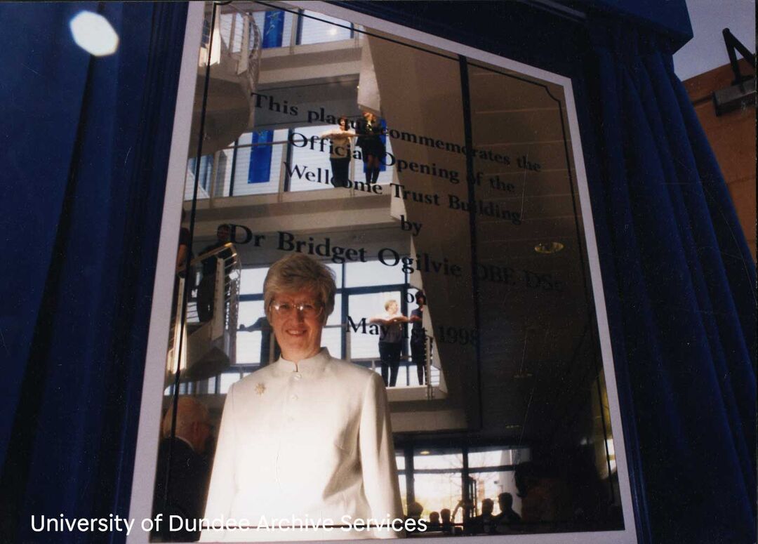 Bridget Ogilvie reflected in a plaque dedicated to her.