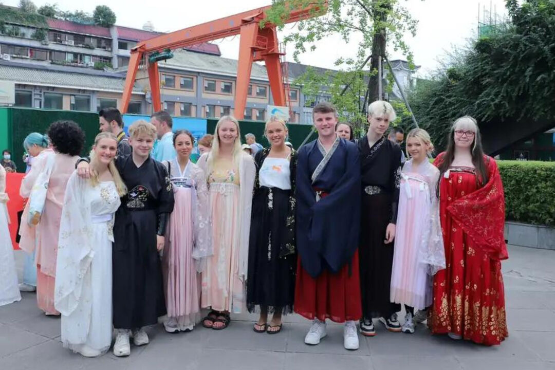 Josh and his exchange student companions dressed in traditional Chinese clothing
