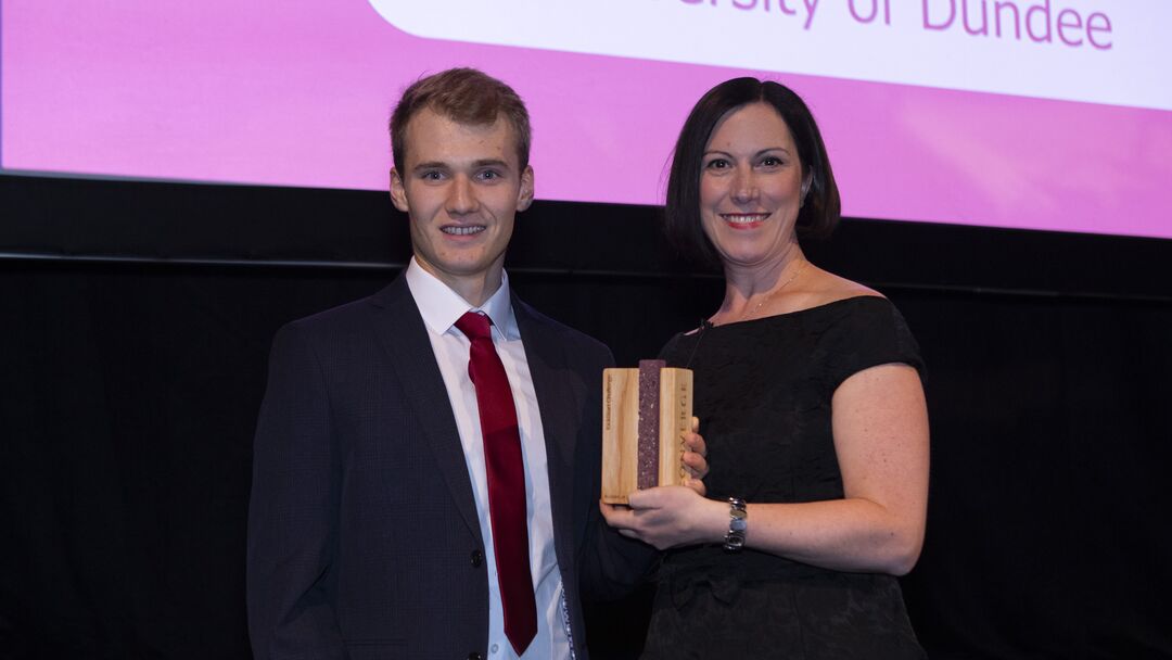 Ryan receiving his award at Converge Awards 2023