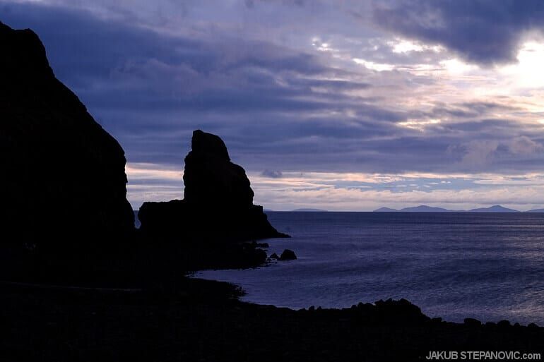 rock and sea at sunset
