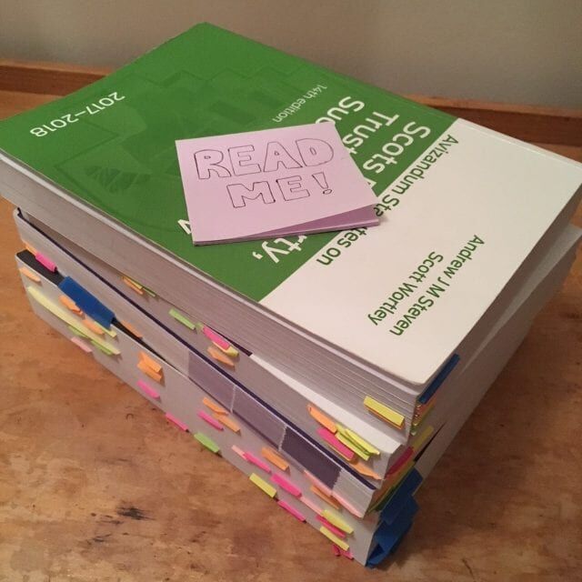 Books with post-it notes on top