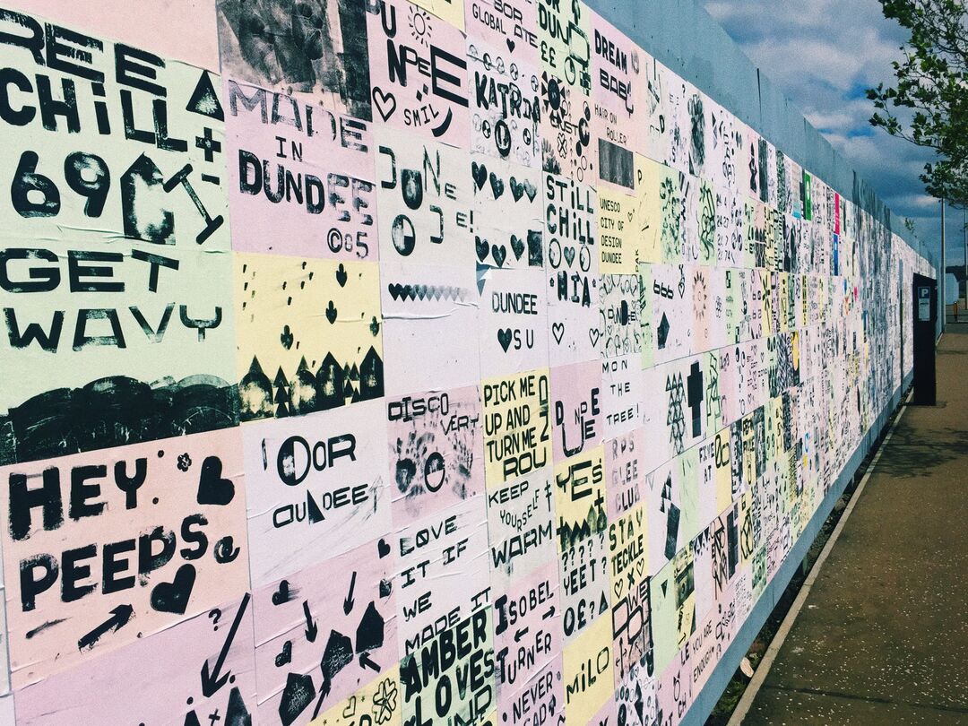 wall covered in posters