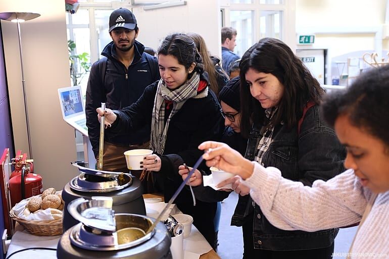 students ladling out soup