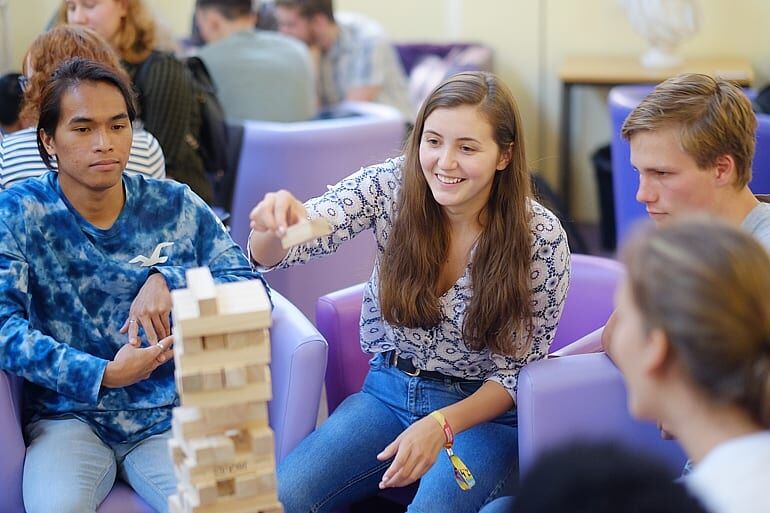 students building a jenga tower
