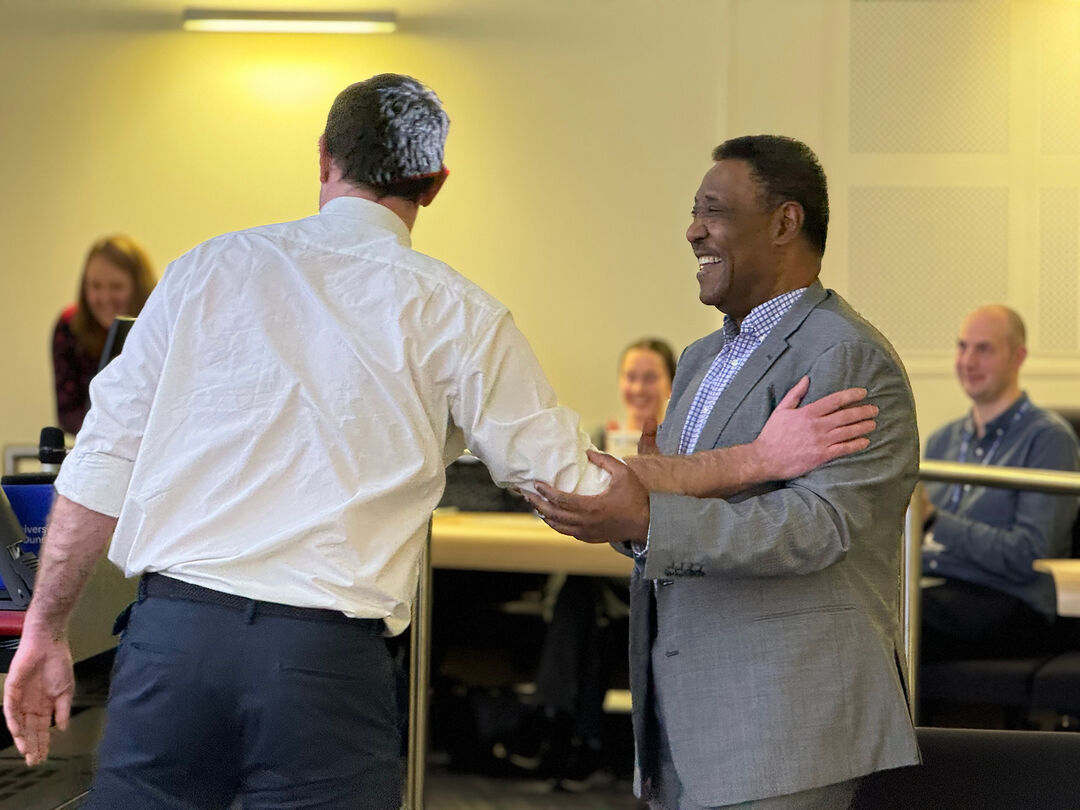 Shihab and a member of staff at Shihab's farewell