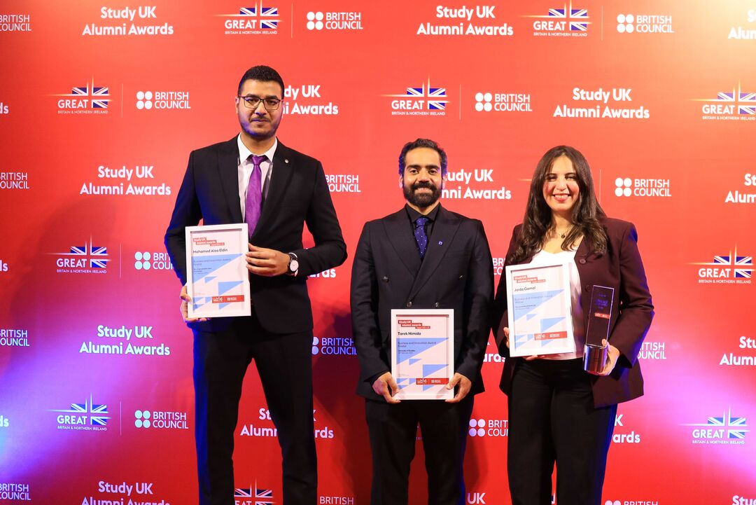 Tarek Himida (centre) holding his award from Study UK Alumni